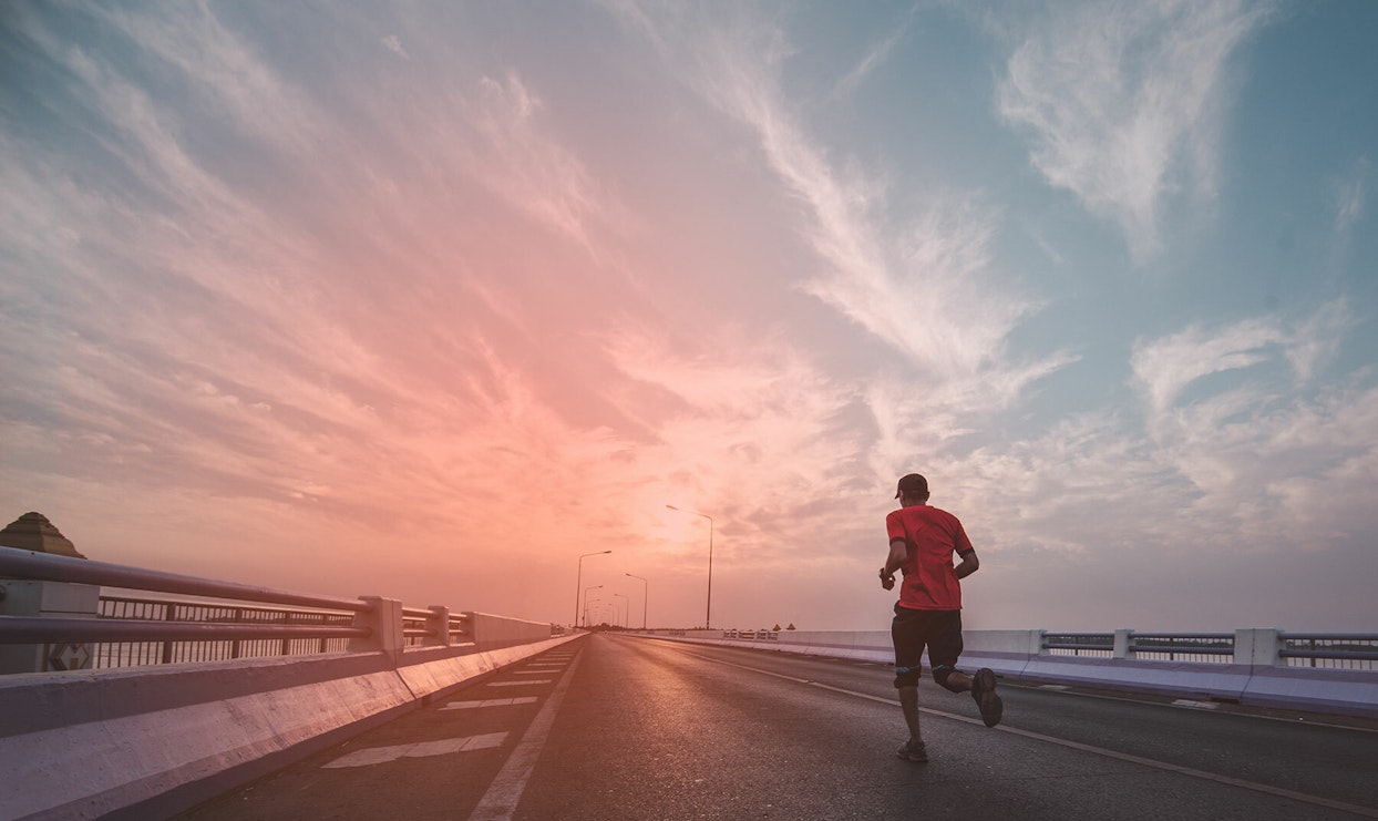 Man running with sport earbuds